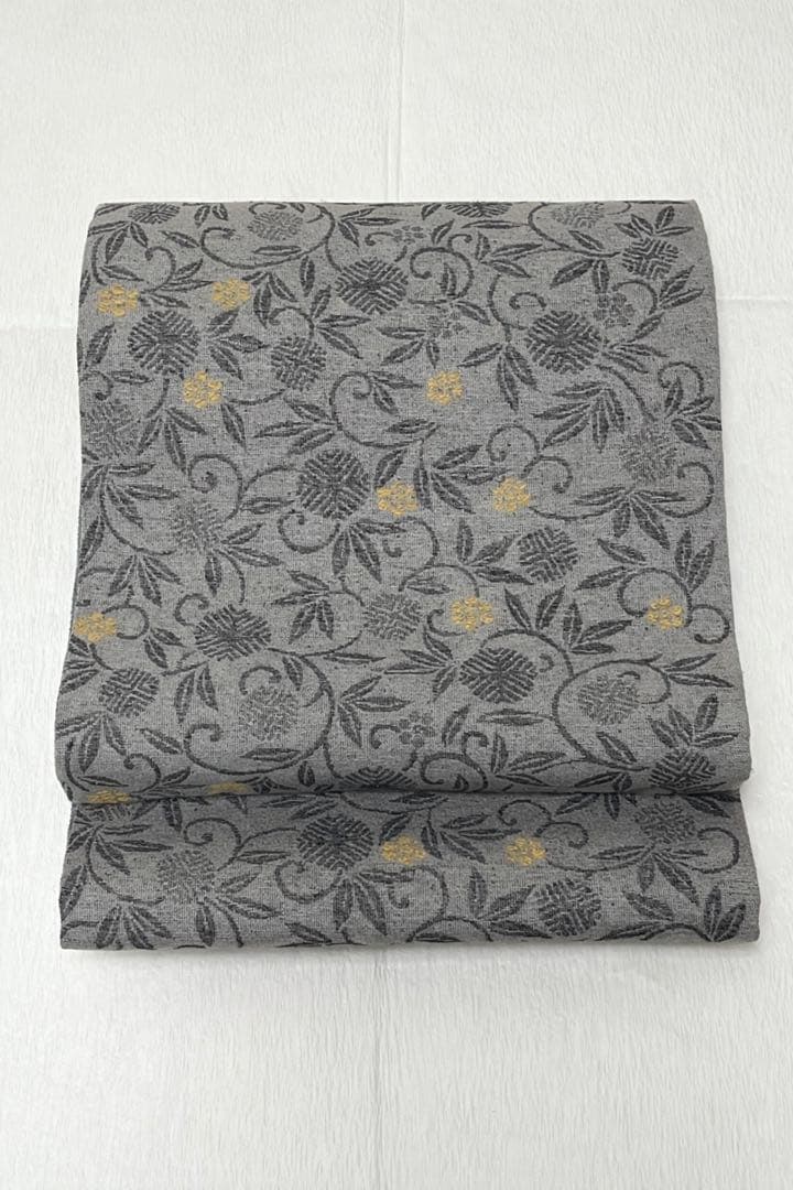 【門間貴美子 】新品未使用　正絹 洒落袋帯 草花唐草文様 錫色グレー 紬調